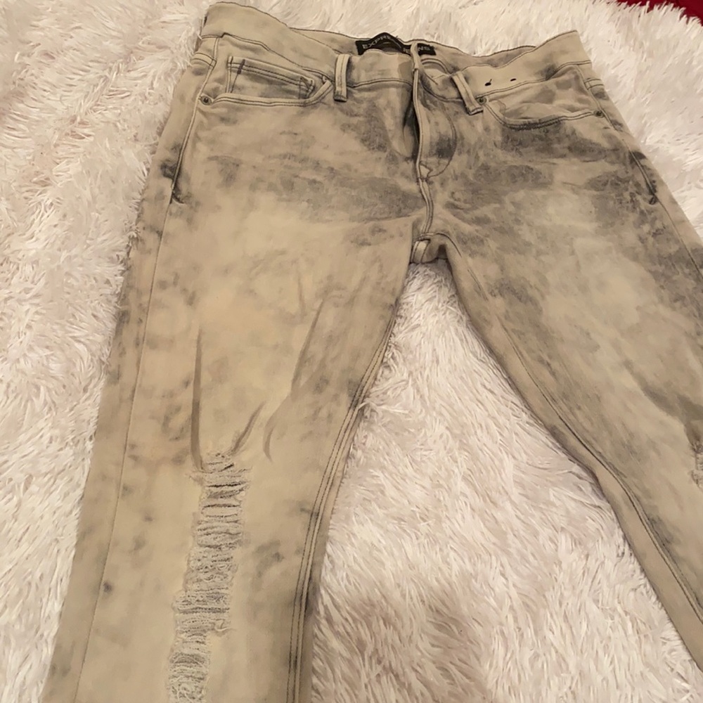 Express distressed stretched stone washed jeans.